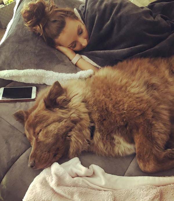 A picture of Ashley and Bubba taking a nap together.